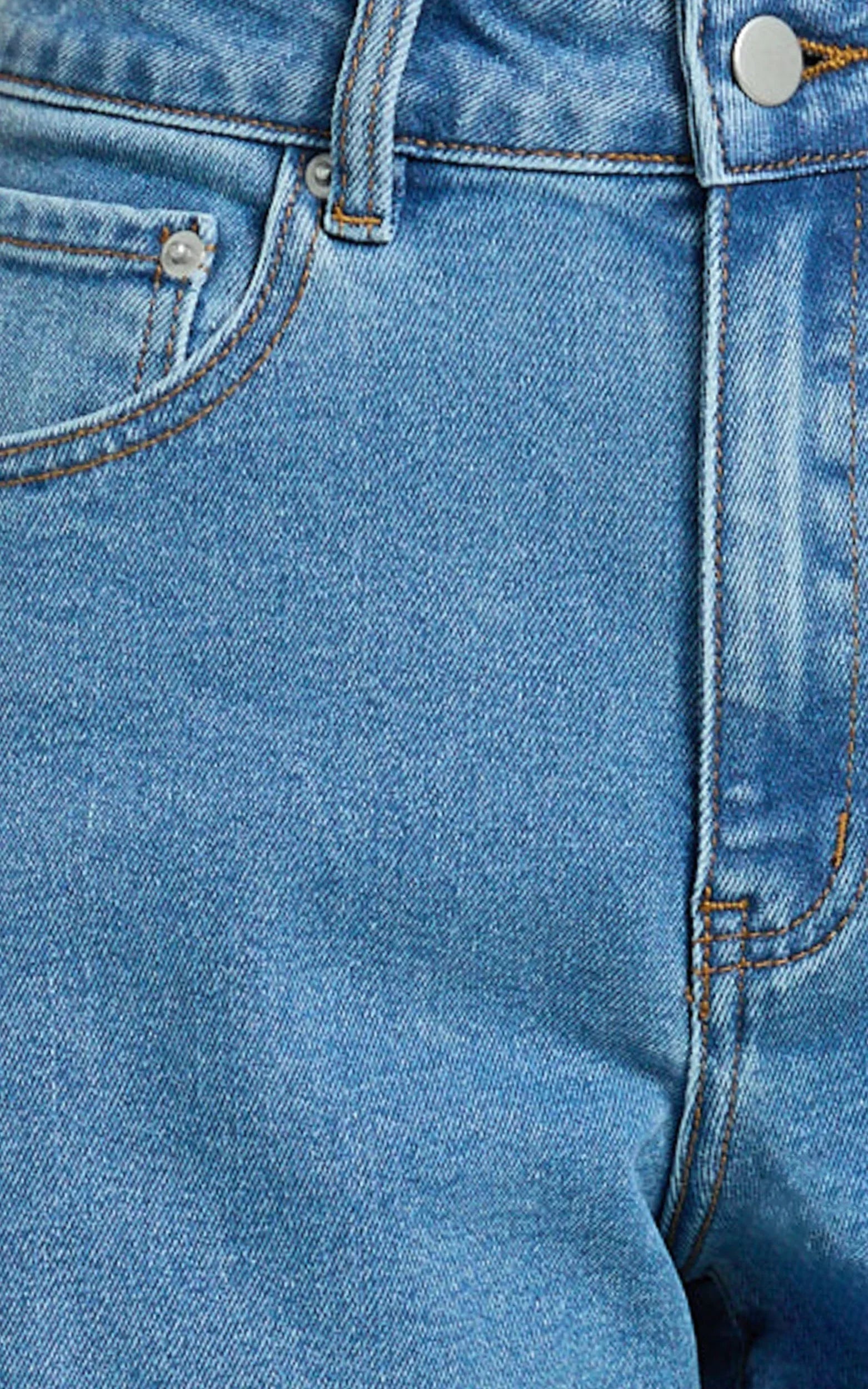 Jacqui Shorts - Mid Rise Frayed Hem Denim Shorts in Light Mid Blue