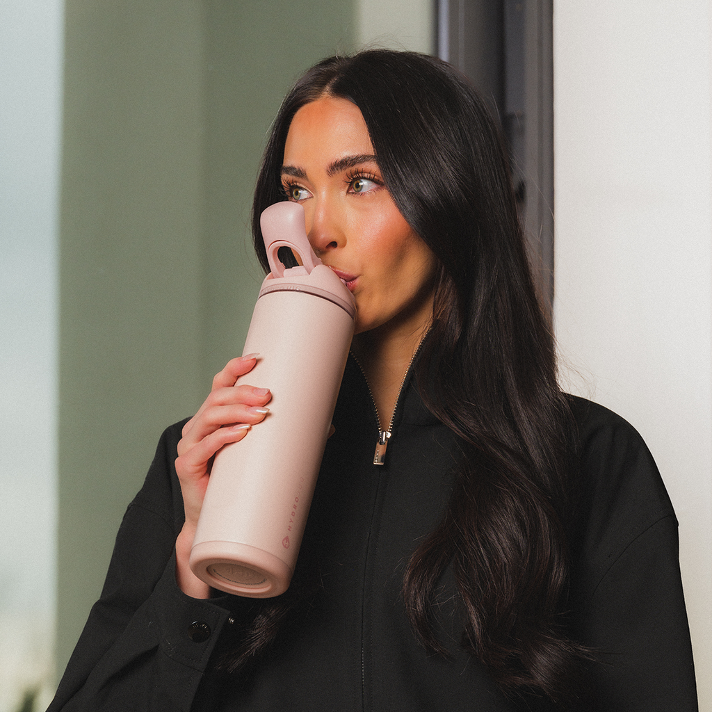 Woman Drinking from 24oz Dusty Rose HydroJug Ease2o